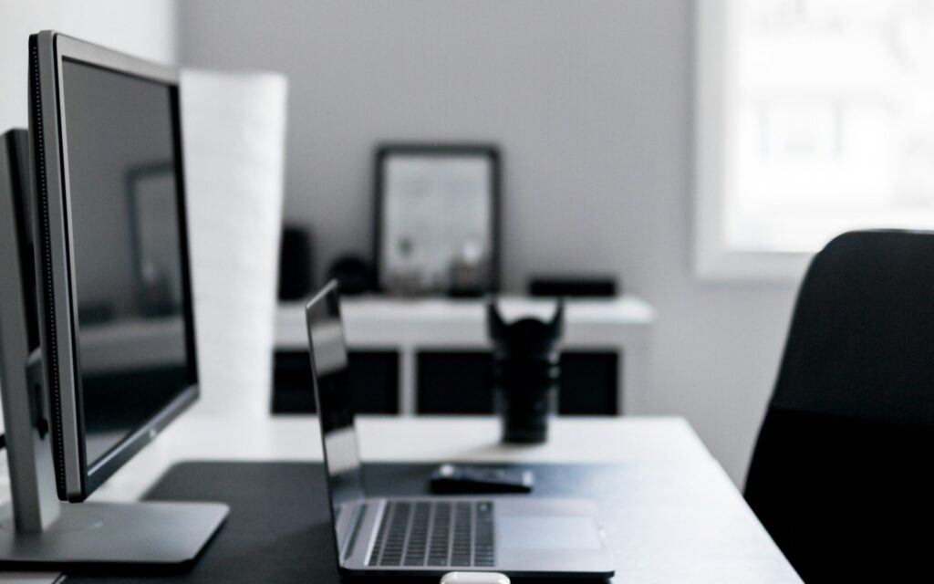 Laptop and accessories arranged on a modern office desk